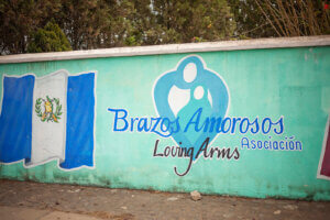 Brazos Amorosos or Loving Arms signage at the site.